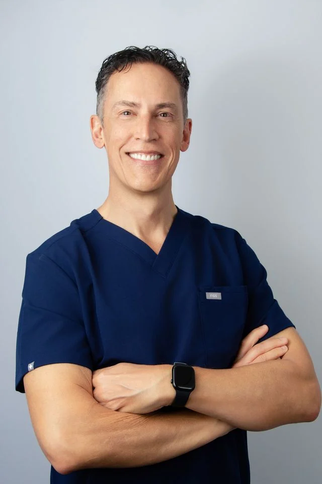 Dr. John Aker, board-certified plastic surgeon